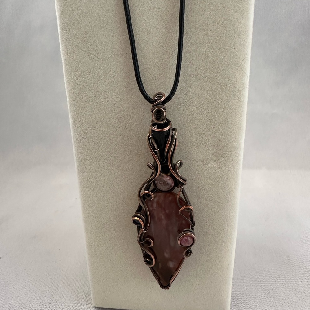 Copper wire wrapped rusty red colored agate pendant with gemstones